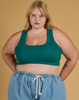Juliet is 5’7” and wearing L Contrast Stitch Mini Tank in Hunter Green