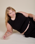 Juliet is wearing Muscle Tee in Basic Black