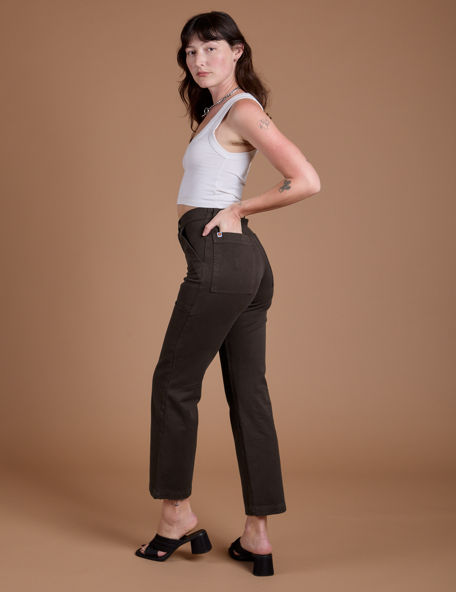 Angled back view of Organic Work Pants in Espresso Brown on Alex