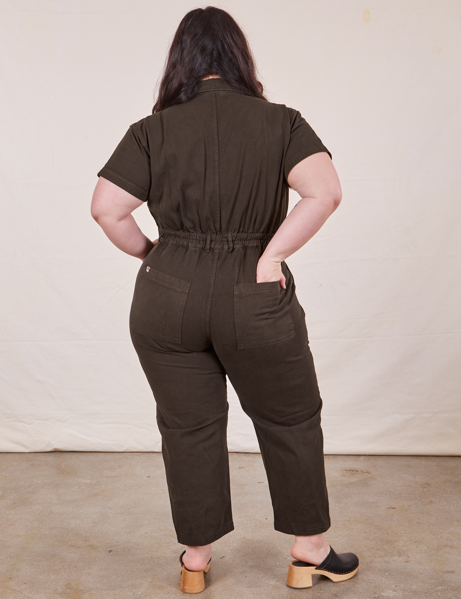 Petite Short Sleeve Jumpsuit in Espresso Brown back view on Ashley