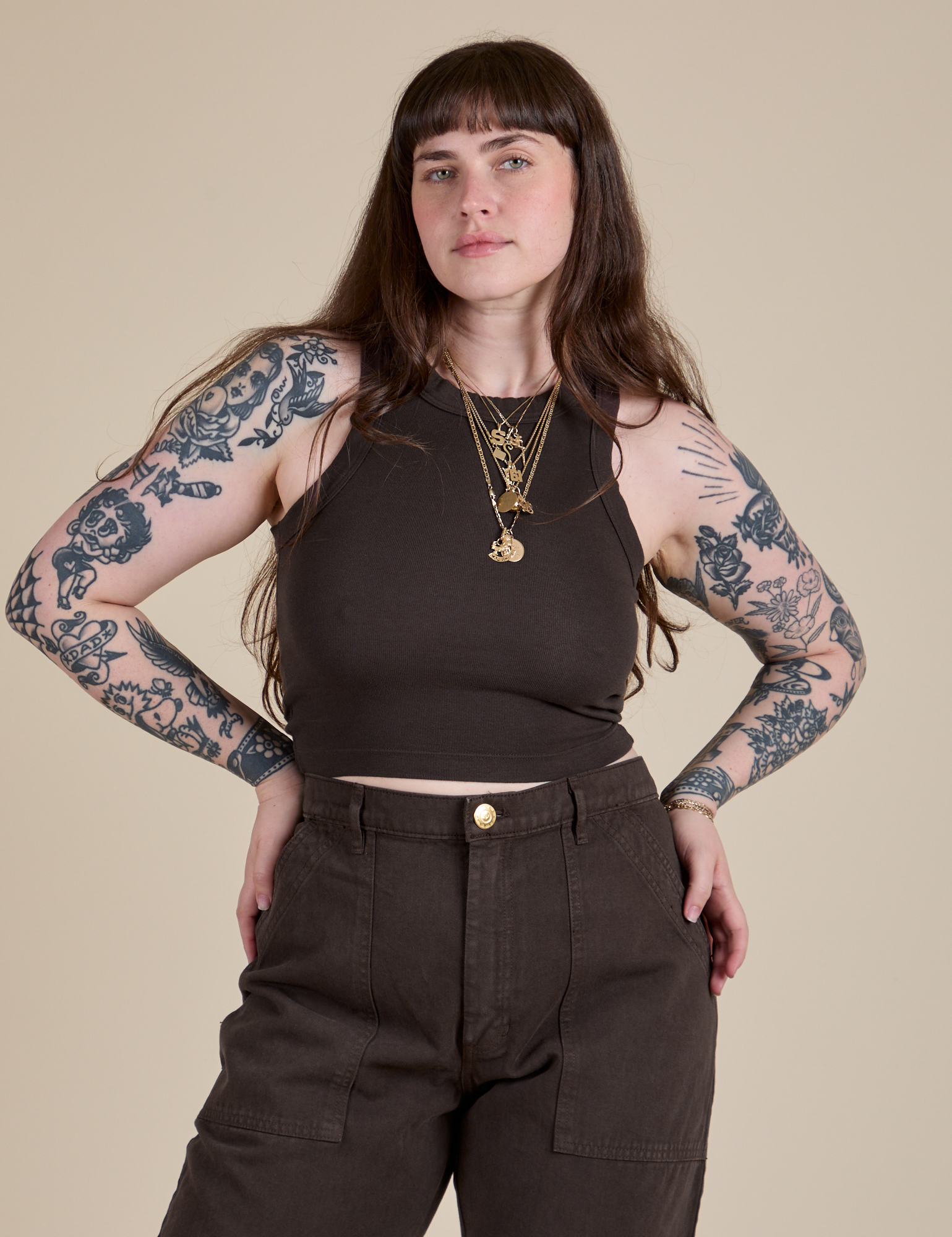Sydney is 5’9” and wearing XXS Racerback Tank in Espresso Brown