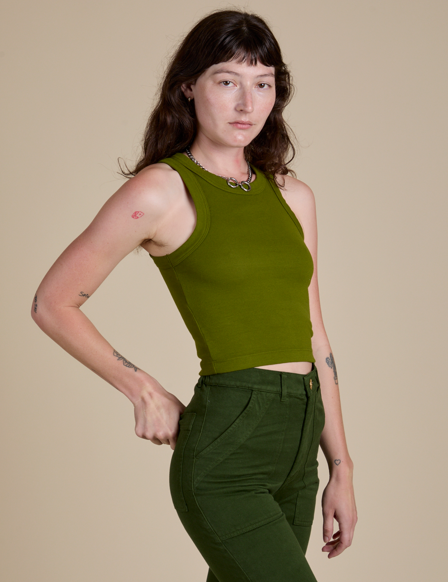 Racerback Tank in Summer Olive angled front view on Alex