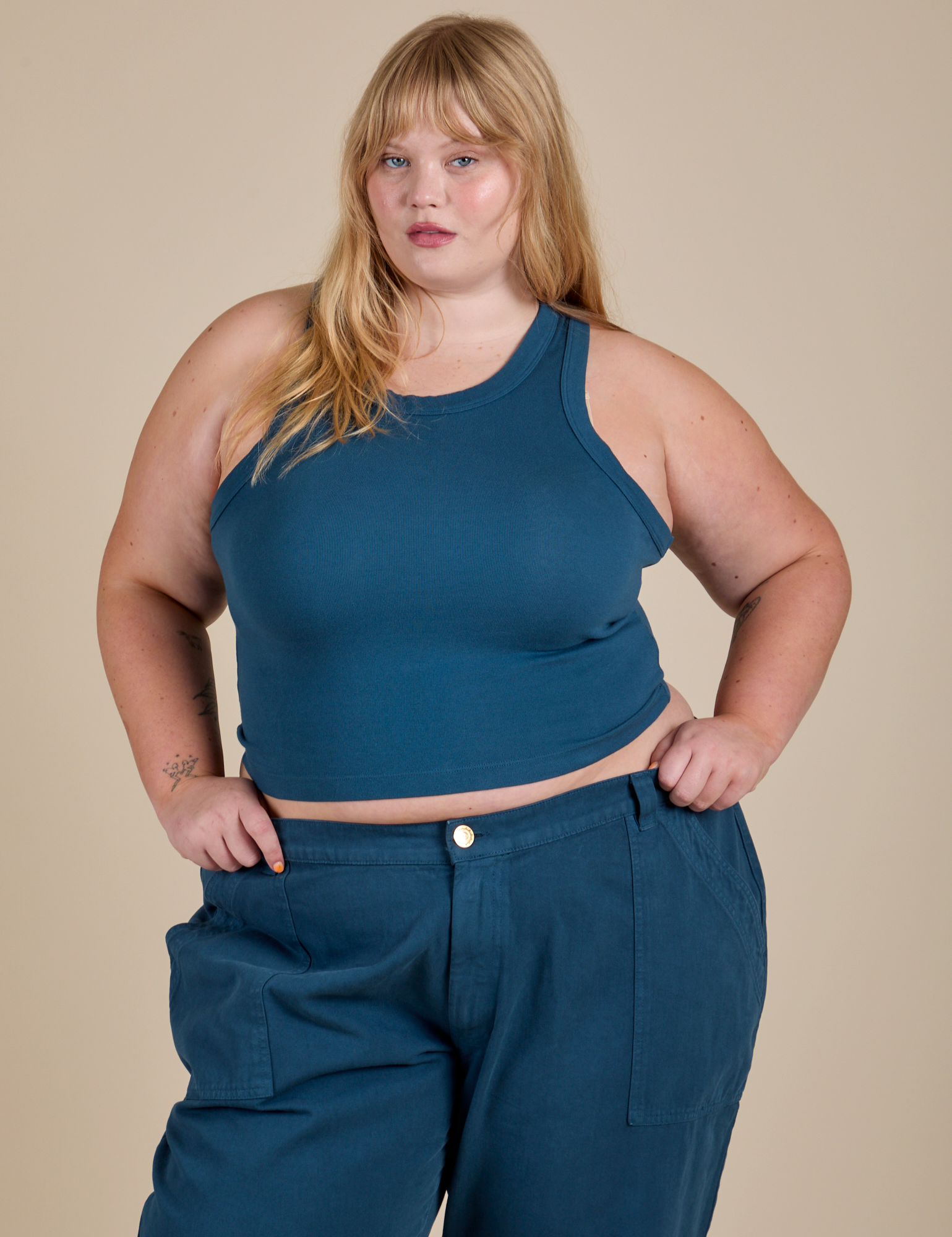 Juliet is 5’7” and wearing L Racerback Tank in Lagoon