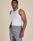 Angled front view of Racerback Tank in Vintage Tee White on Isaac