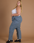 Side view of Railroad Denim Work Pants in Natural and vintage tee white Cropped Tank on Juliet
