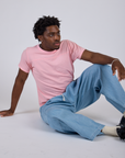 Jr. Varsity Tee in Baby Pink and light wash Denim Drop Pocket Pants on Isaac