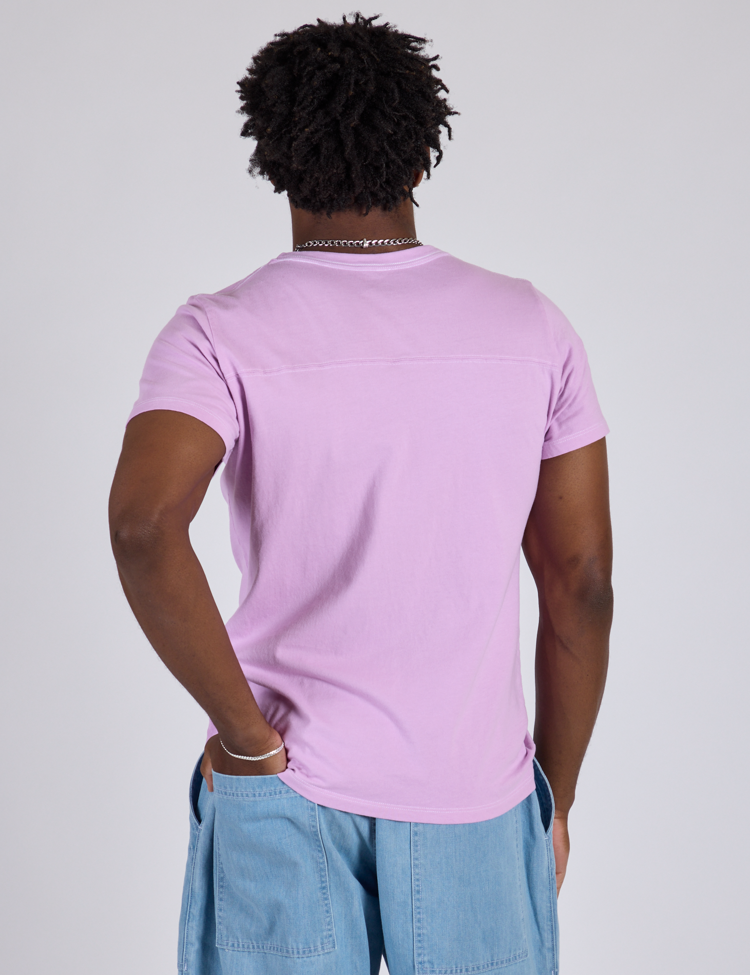 Jr. Varsity Tee in Lilac Purple back view on Isaac