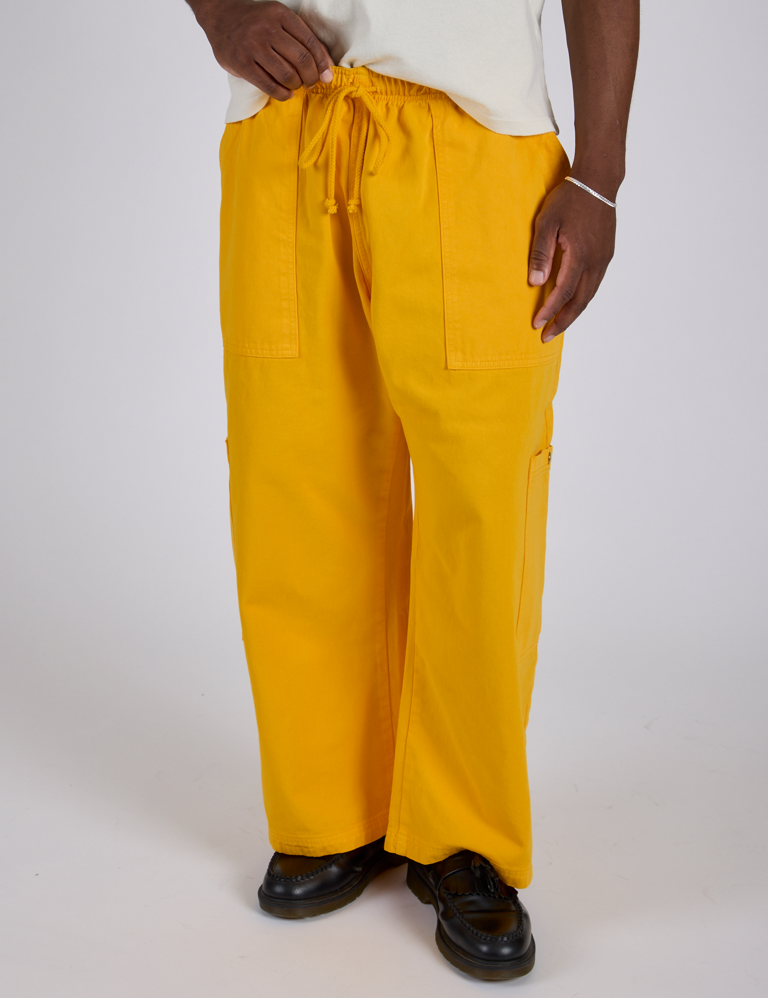 Drop Pocket Cargo Pants in Sunshine Yellow close up on Isaac