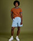 Vintage Ringer Tee in Burnt Terracotta and light wash Carpenter Shorts on Jerrod