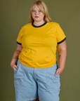 Juliet is 5’7” and wearing L Vintage Ringer Tee in Sunshine Yellow