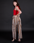 Striped Drop Pocket Pants in Retro Rainbow angled back view on Alex
