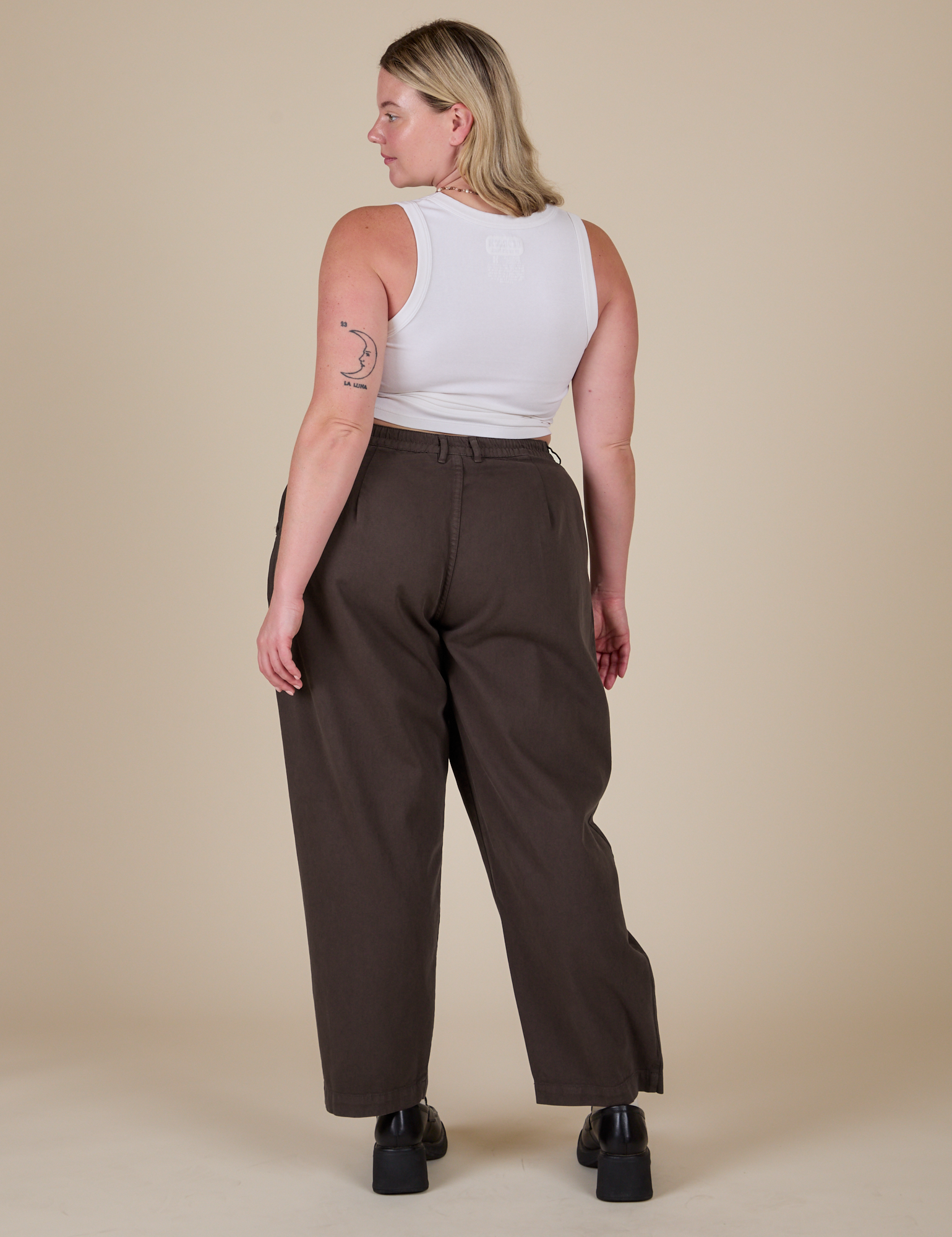 Back view of Heavyweight Trousers in Espresso Brown and vintage tee white Cropped Tank on Lish