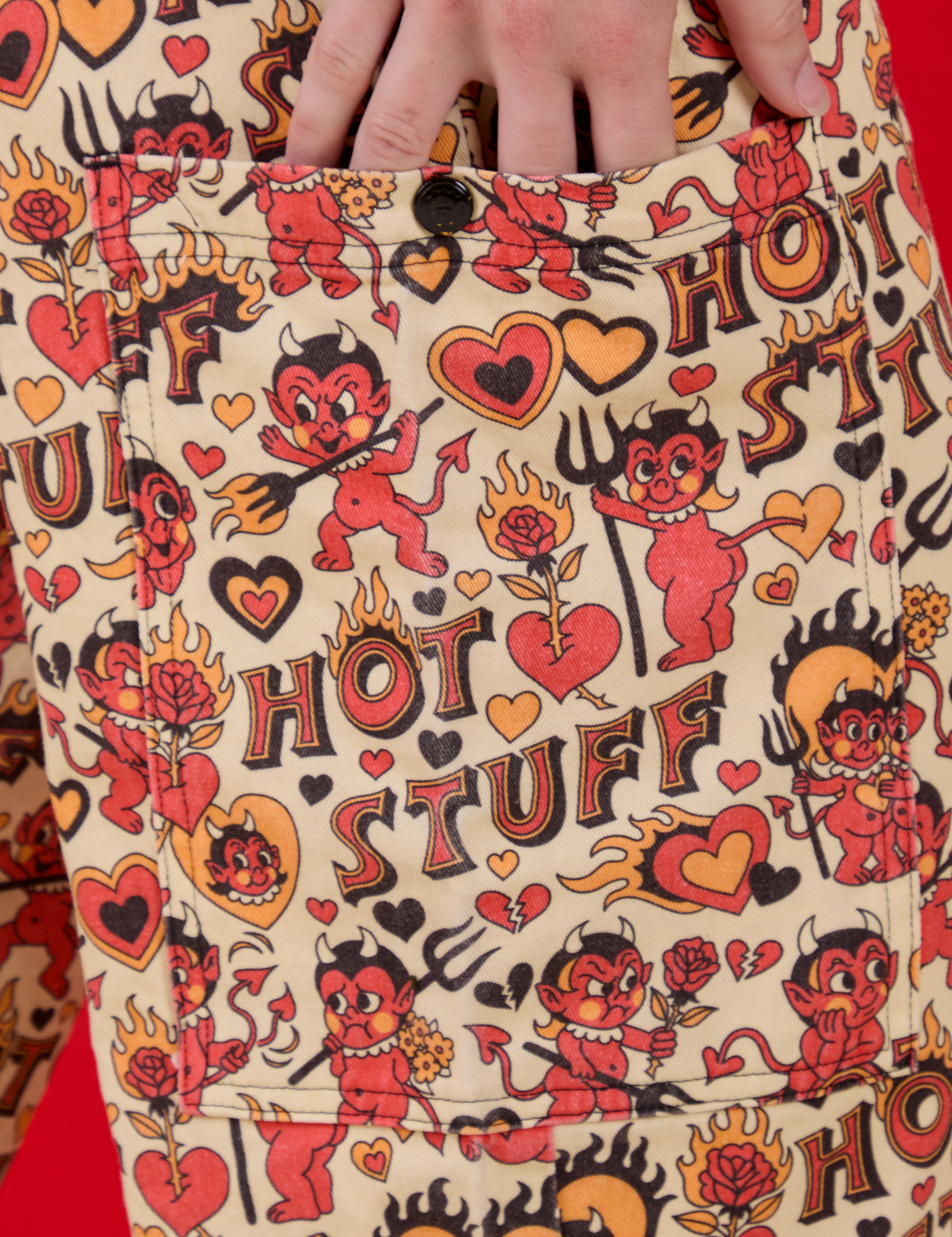 Close up of Alex's hand in the side pocket of Hot Stuff Drop Pocket Cargo Pants