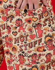Close up of Alex's hand in the side pocket of Hot Stuff Drop Pocket Cargo Pants
