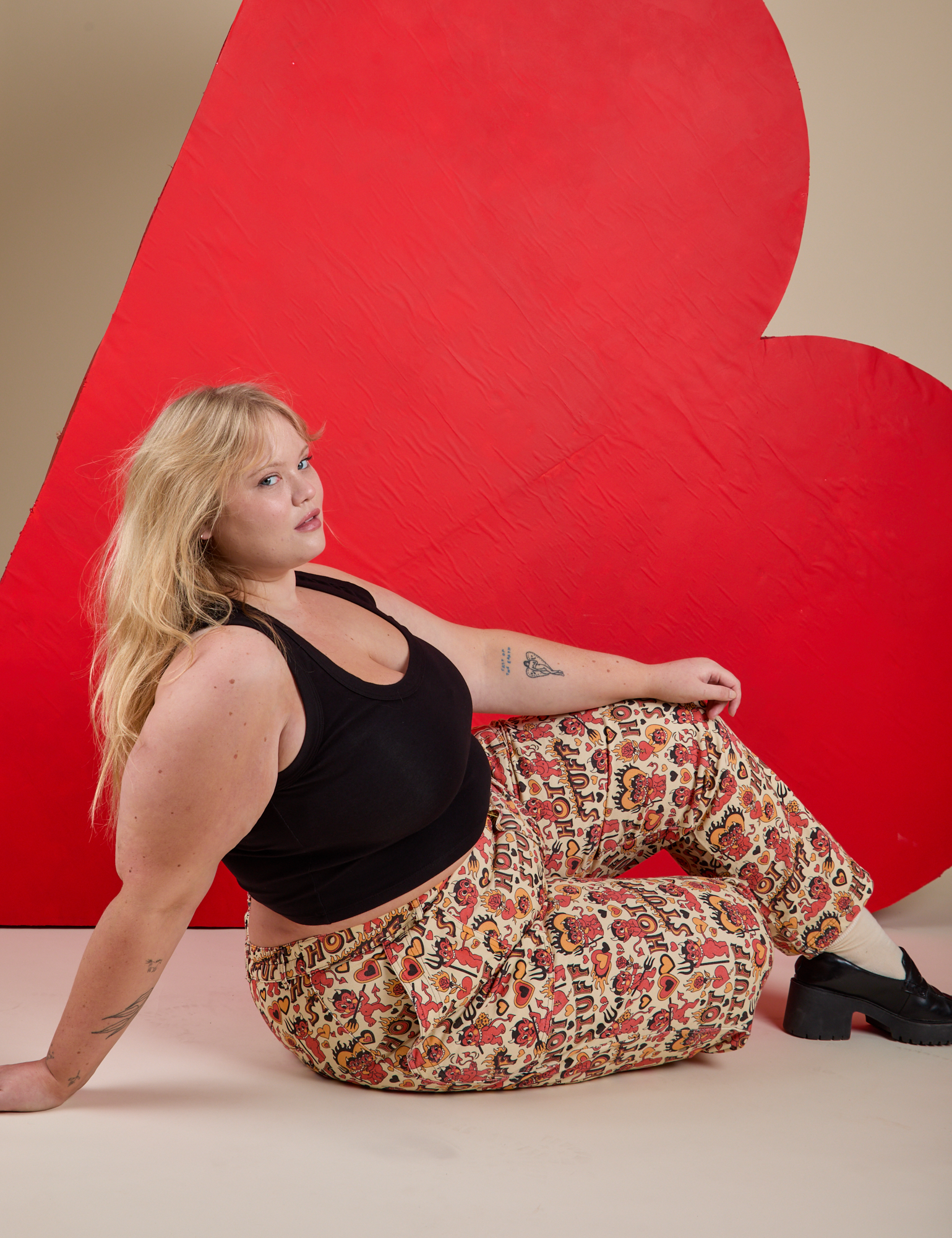 Work Pants in Hot Stuff Print and black Cropped Tank on Juliet
