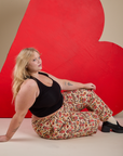 Work Pants in Hot Stuff Print and black Cropped Tank on Juliet