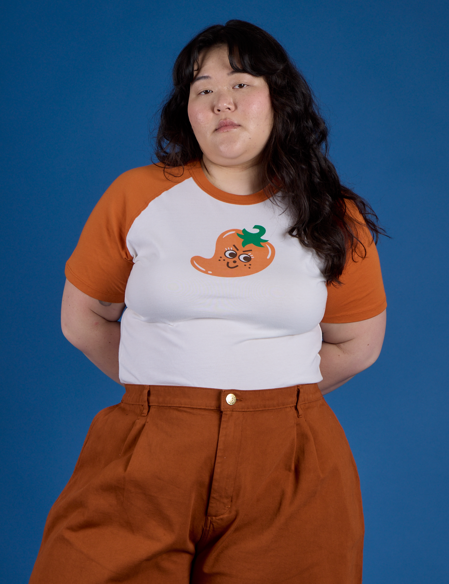 Ashley is 5’7” and wearing XL Produce Raglan Tee in Habanero