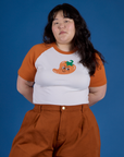 Ashley is 5’7” and wearing XL Produce Raglan Tee in Habanero