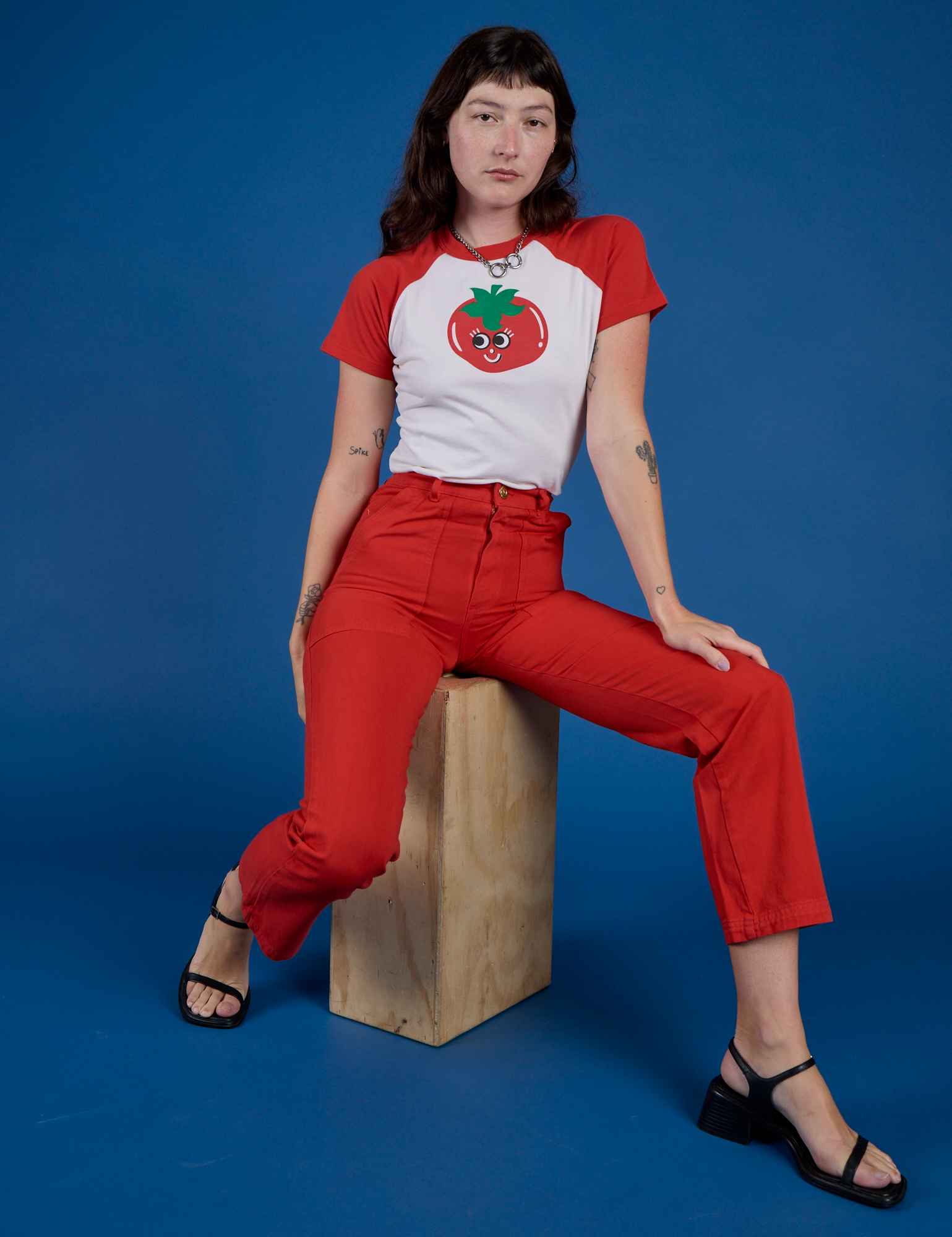 Produce Raglan Tee in Tomato and mustang red Work Pants worn by Alex