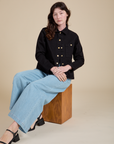 Work Jacket in Basic Black and light wash Indigo Wide Leg Trousers on Alex