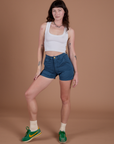 Alex is 5’8” and wearing XXS Classic Work Shorts in French Blue paired with Cropped Tank in Vintage Tee White 