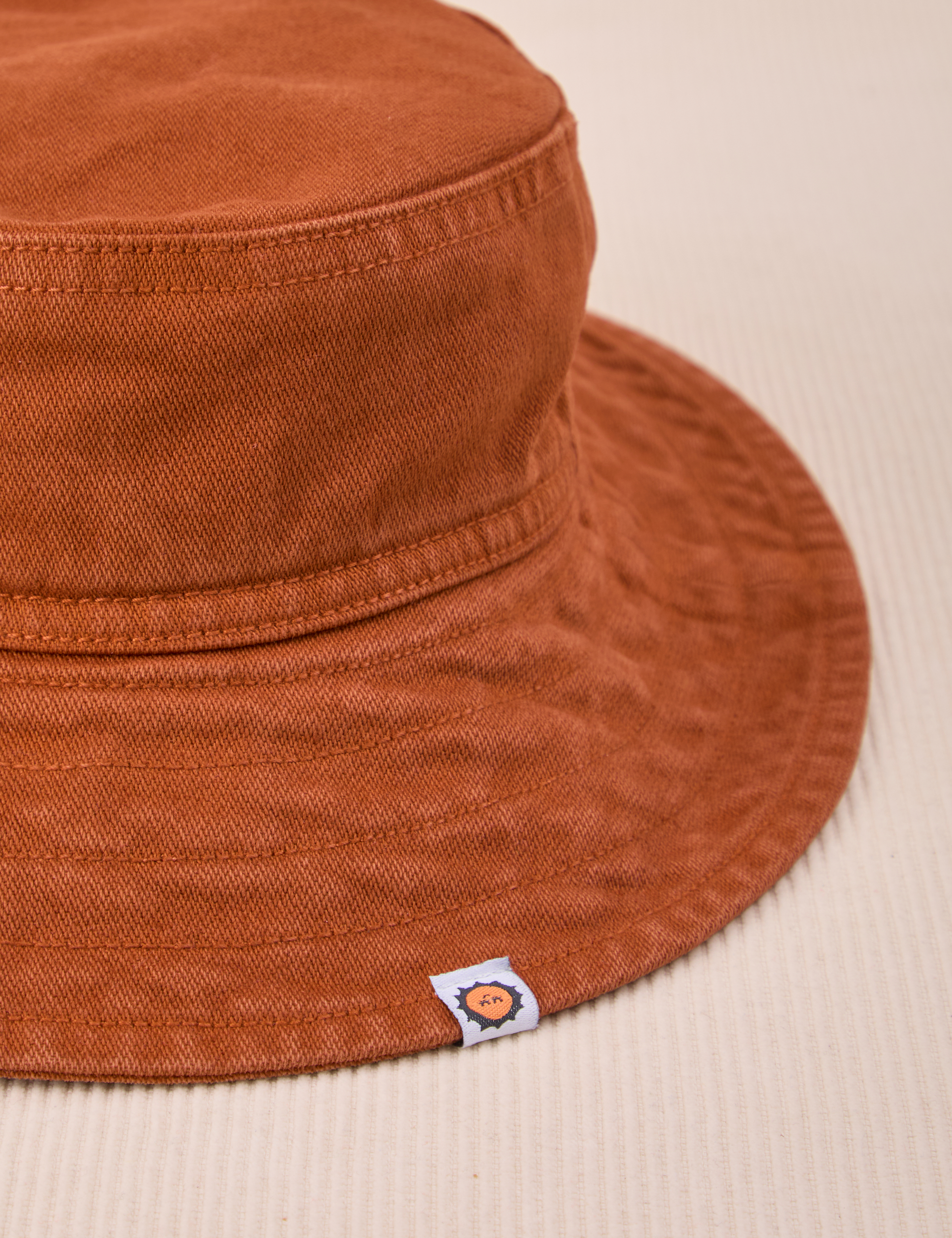 Wide Brim Denim Bucket Hats in Burnt Terracotta Close up
