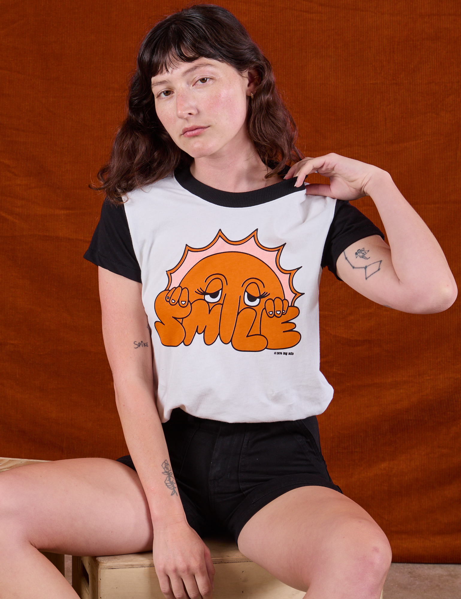 Anniversary Tee in Smile and black Work Shorts on Alex