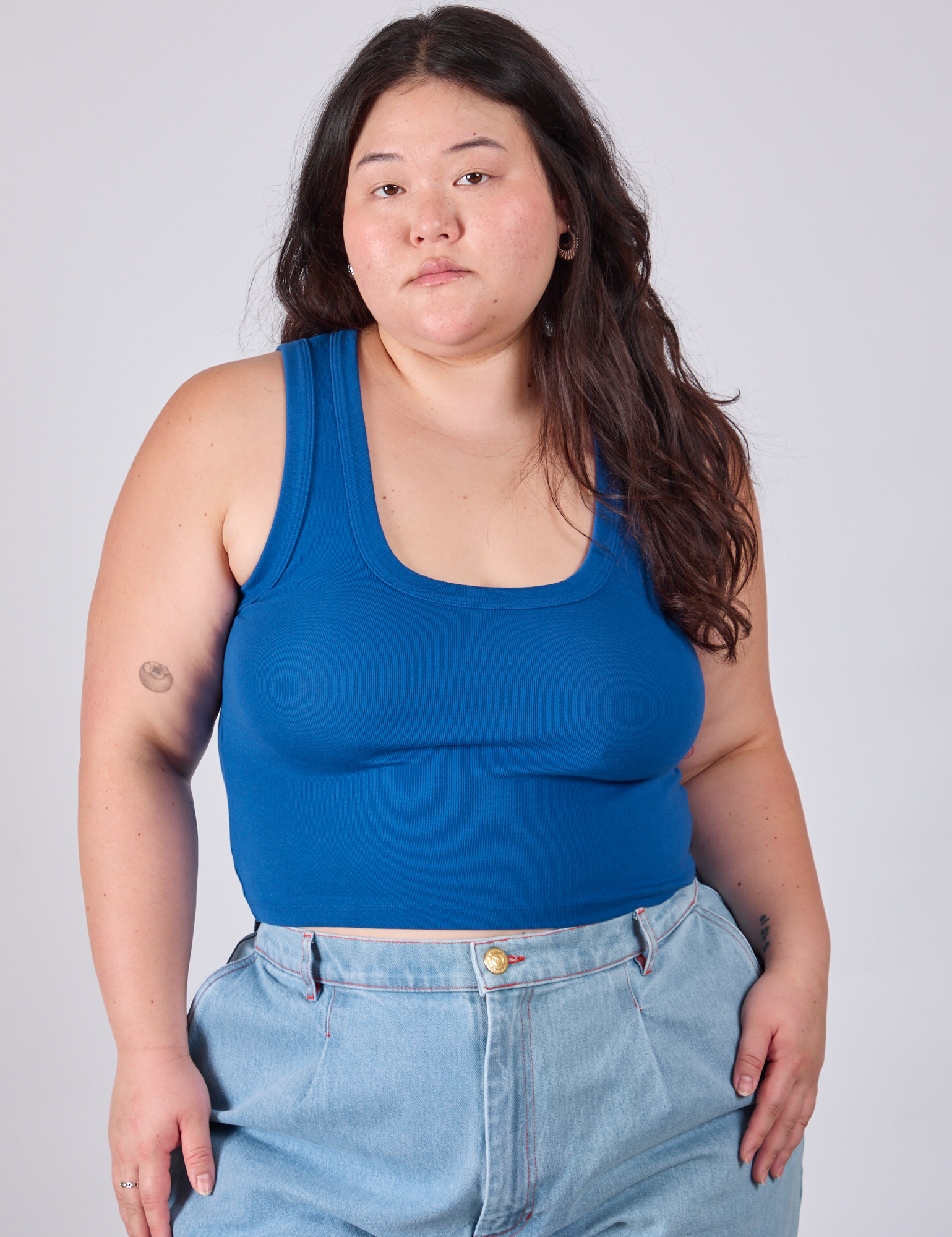 Ashley is 5'7" and wearing L Cropped Tank Top in Royal Blue