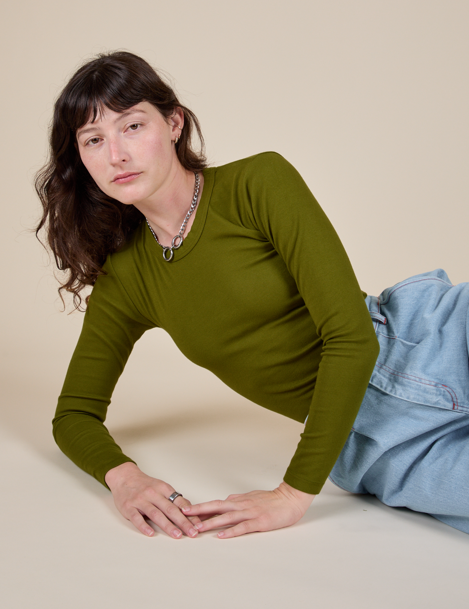 Long Sleeve Baby Tee in Summer Olive worn by Alex