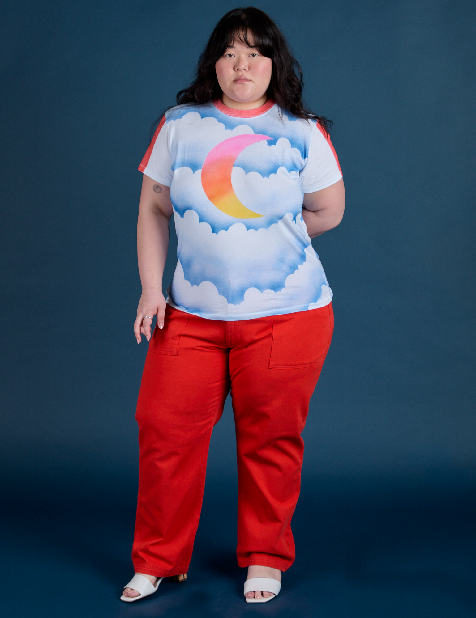Ashley is 5’7” and wearing L Airbrush Moon Vintage Tee paired with mustang red Work Pants
