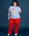 Ashley is 5’7” and wearing L Airbrush Moon Vintage Tee paired with mustang red Work Pants