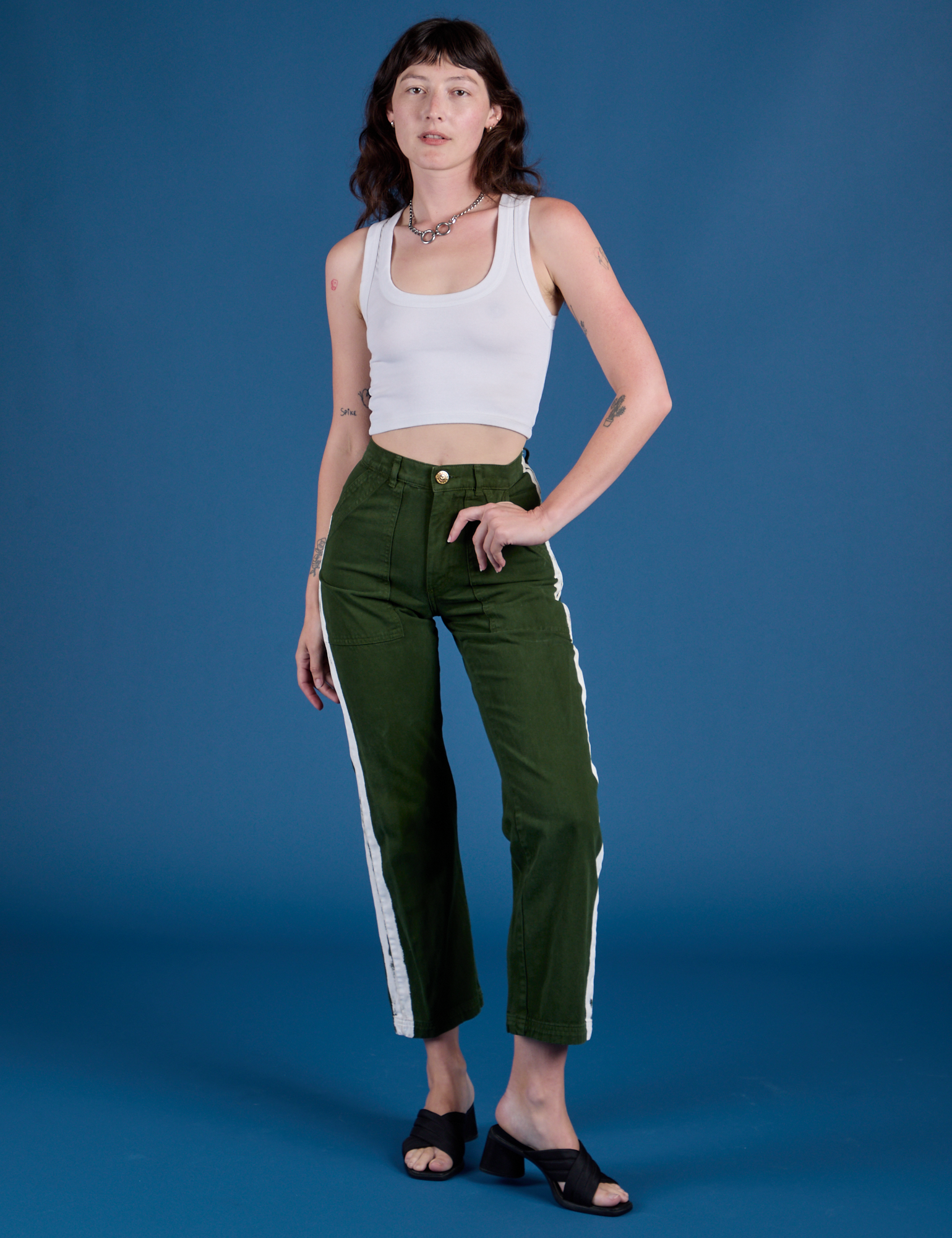 Alex is 5’8” and wearing XXS Painted Work Pants in Evergreen paired with vintage tee white Cropped Tank