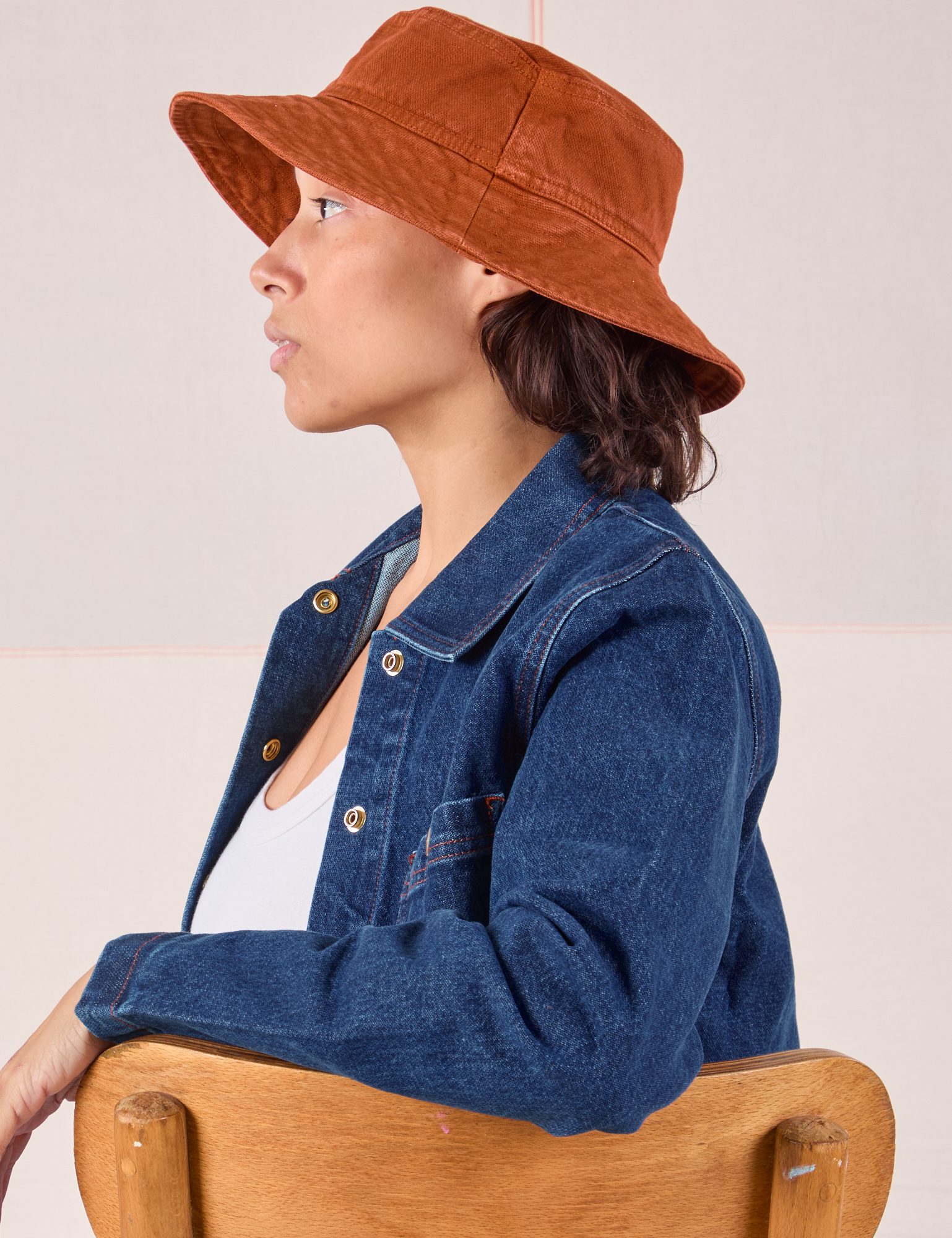 Tiara is wearing Wide Brim Denim Bucket Hats in Burnt Terracotta
