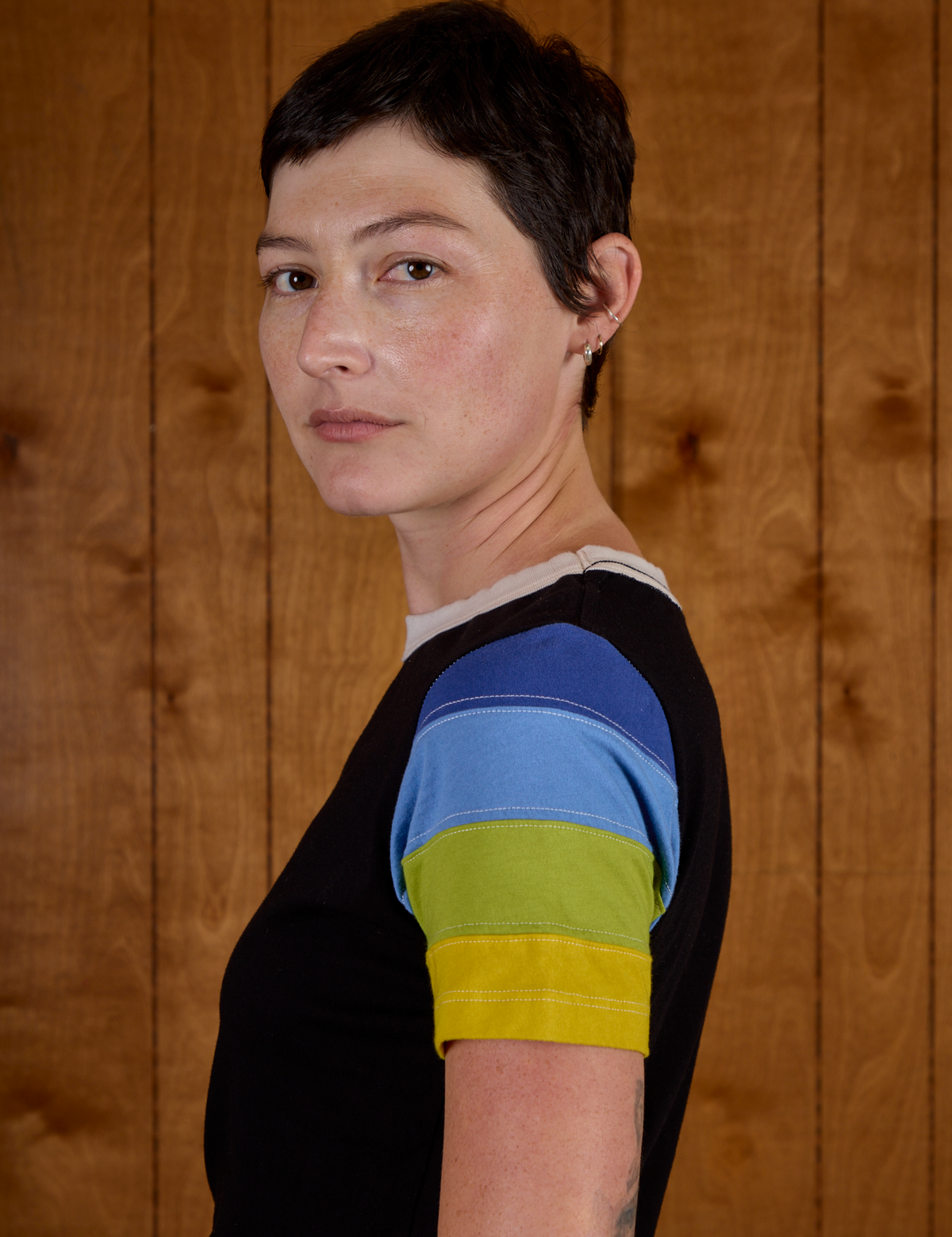 Close up side view of Calypso Tee in Black Multi on Alex