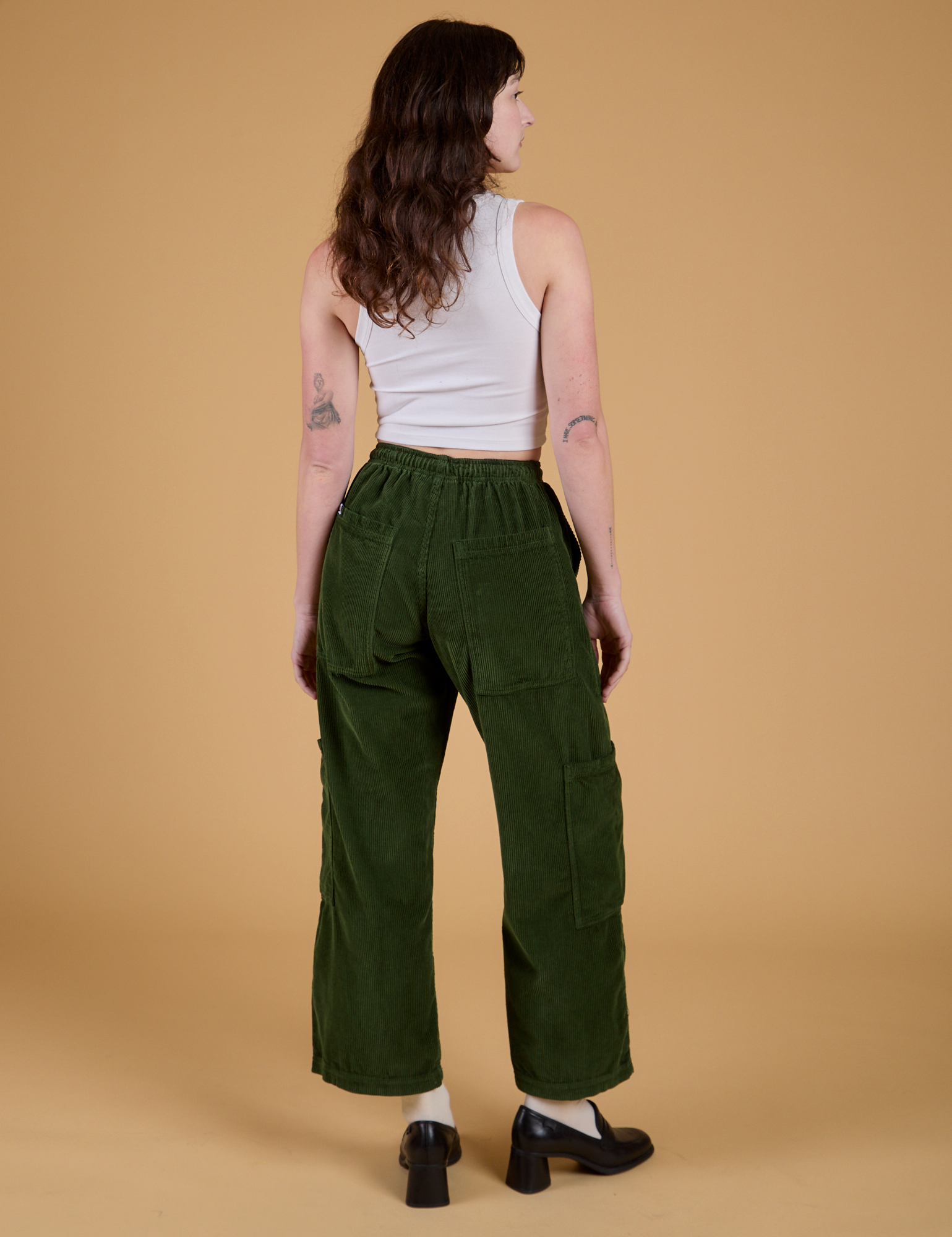 Corduroy Drop Pocket Cargo Pants in Evergreen back view on Alex