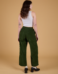 Corduroy Drop Pocket Cargo Pants in Evergreen back view on Alex