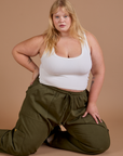 Drop Pocket Cargo Pants in Surplus Green and Cropped Tank in Vintage Tee White worn by Juliet