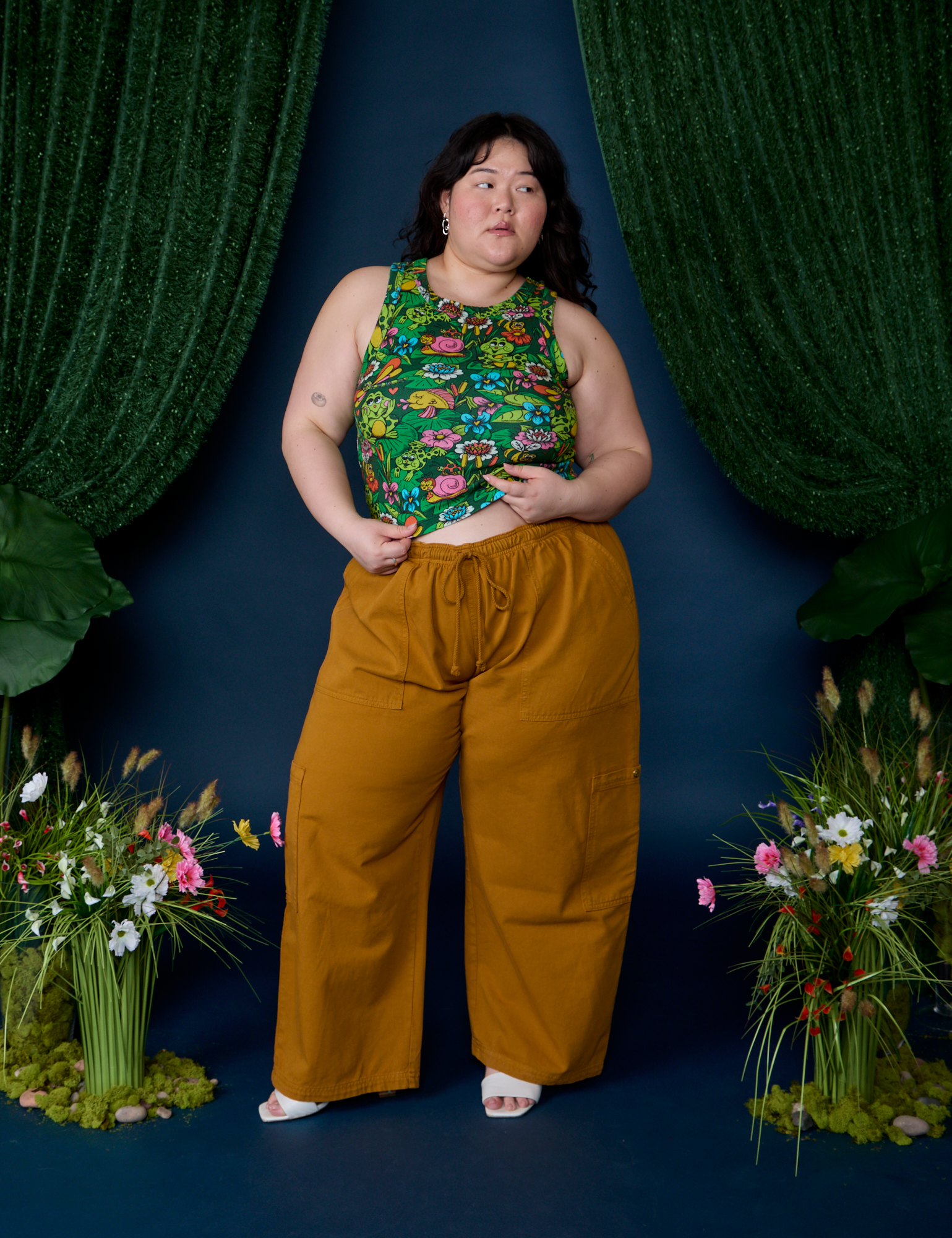 Ashley is wearing Pond Party Racerback Tank paired with spicy mustard Drop Pocket Cargo Pants