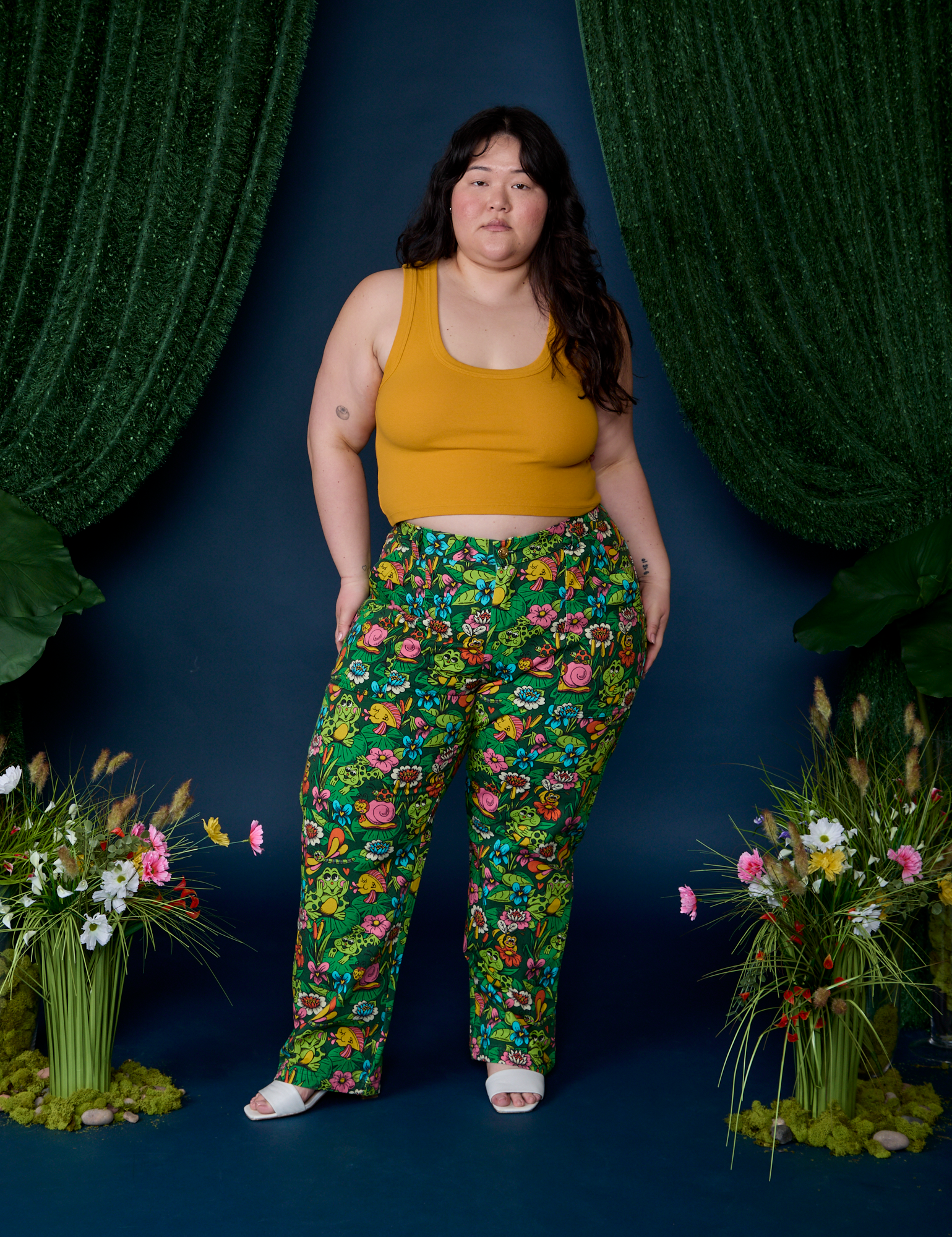 Ashley is wearing Work Pants in Pond Party and mustard yellow Cropped Tank