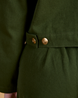 Close up of brass side snaps on Heritage Mechanic Jacket in Evergreen