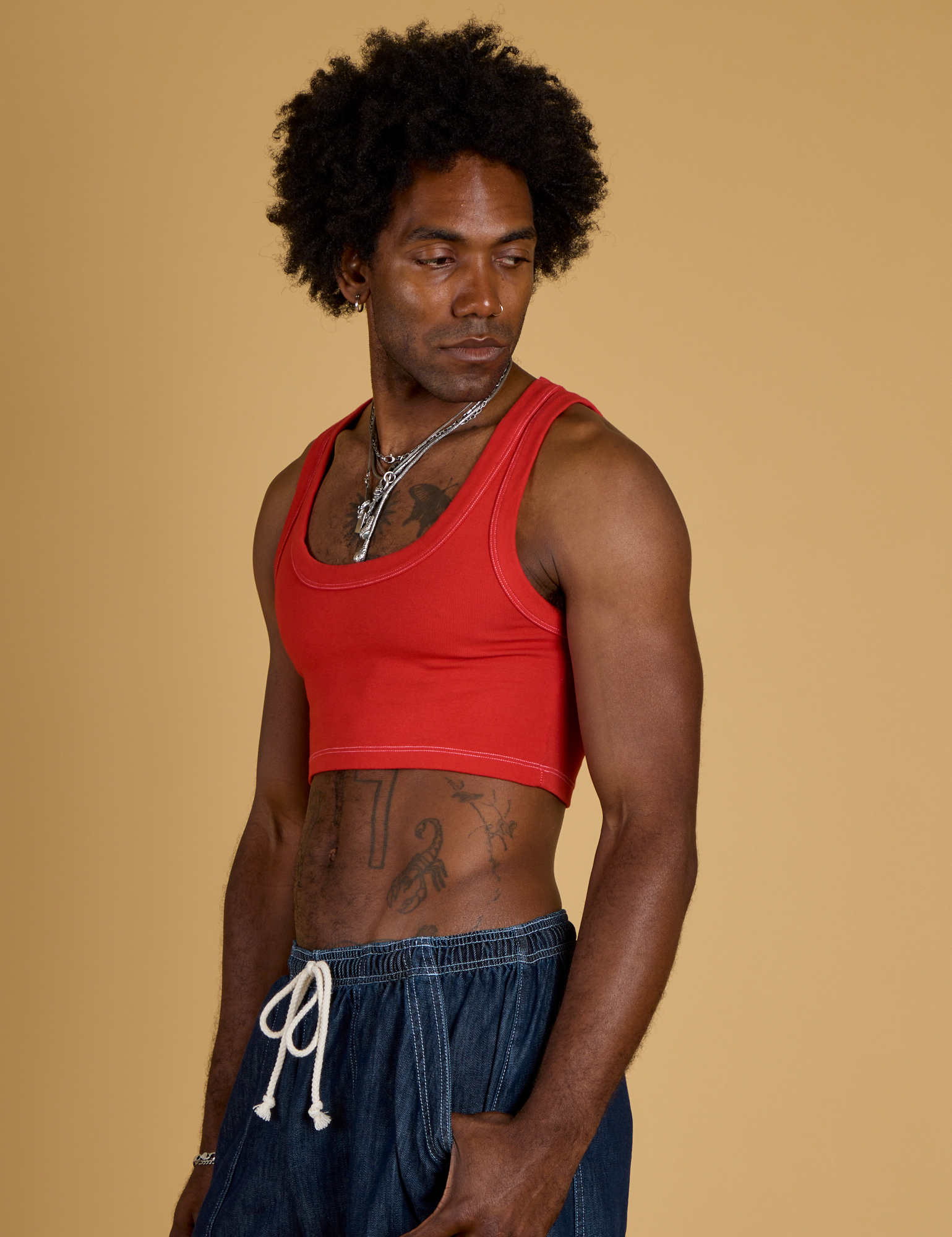 Contrast Stitch Mini Tank in Mustang Red angled front view on Jerrod