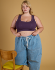 Juliet is wearing Contrast Stitch Mini Tank in Nebula Purple and light wash Denim Drop Pocket Pants