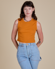Alex is 5’8” and wearing XP Muscle Tee in Creamsicle Orange