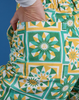 Close up of Alex's hand in the back pocket of Longline Work Shorts in Spring Quilt Print