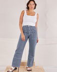 Tiara is 5'4" and wearing S  Carpenter Jeans in Indigo Railroad paired with vintage tee off-white Square Neck Tank