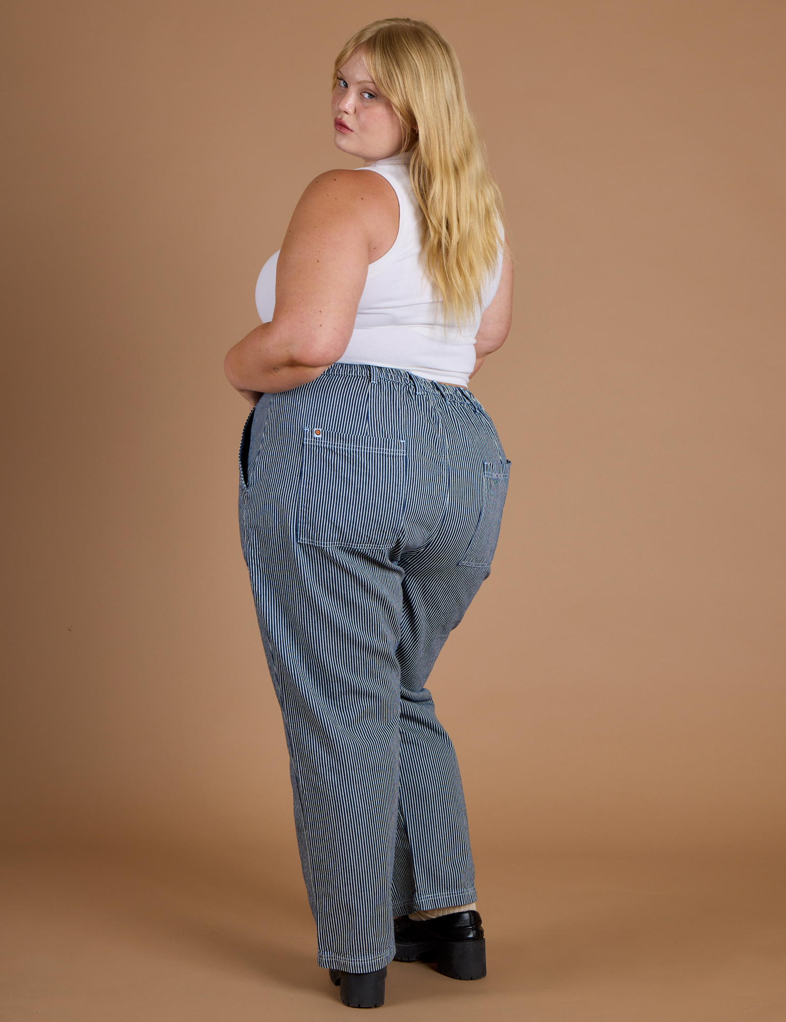 Railroad Denim Work Pants in Natural angled back view on Juliet