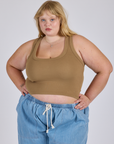 Juliet is 5’7” and wearing L Cropped Tank Top in Desert Brown