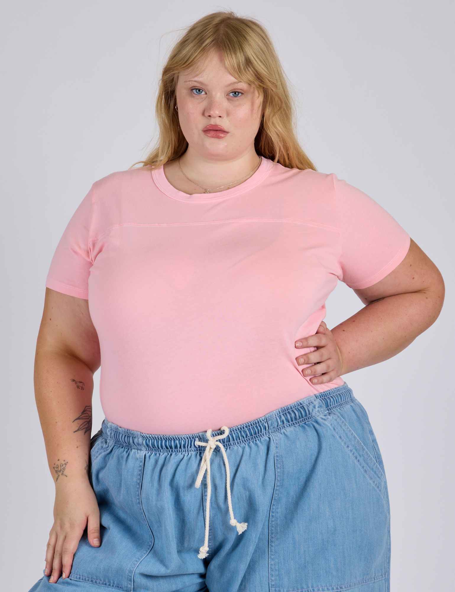 Juliet is 5’7” and wearing L Jr. Varsity Tee in Baby Pink