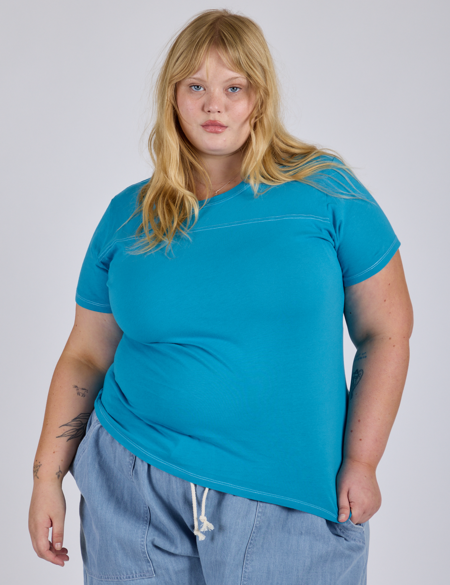 Juliet is 5’7” and wearing L Jr. Varsity Tee in Hawaiian Blue 