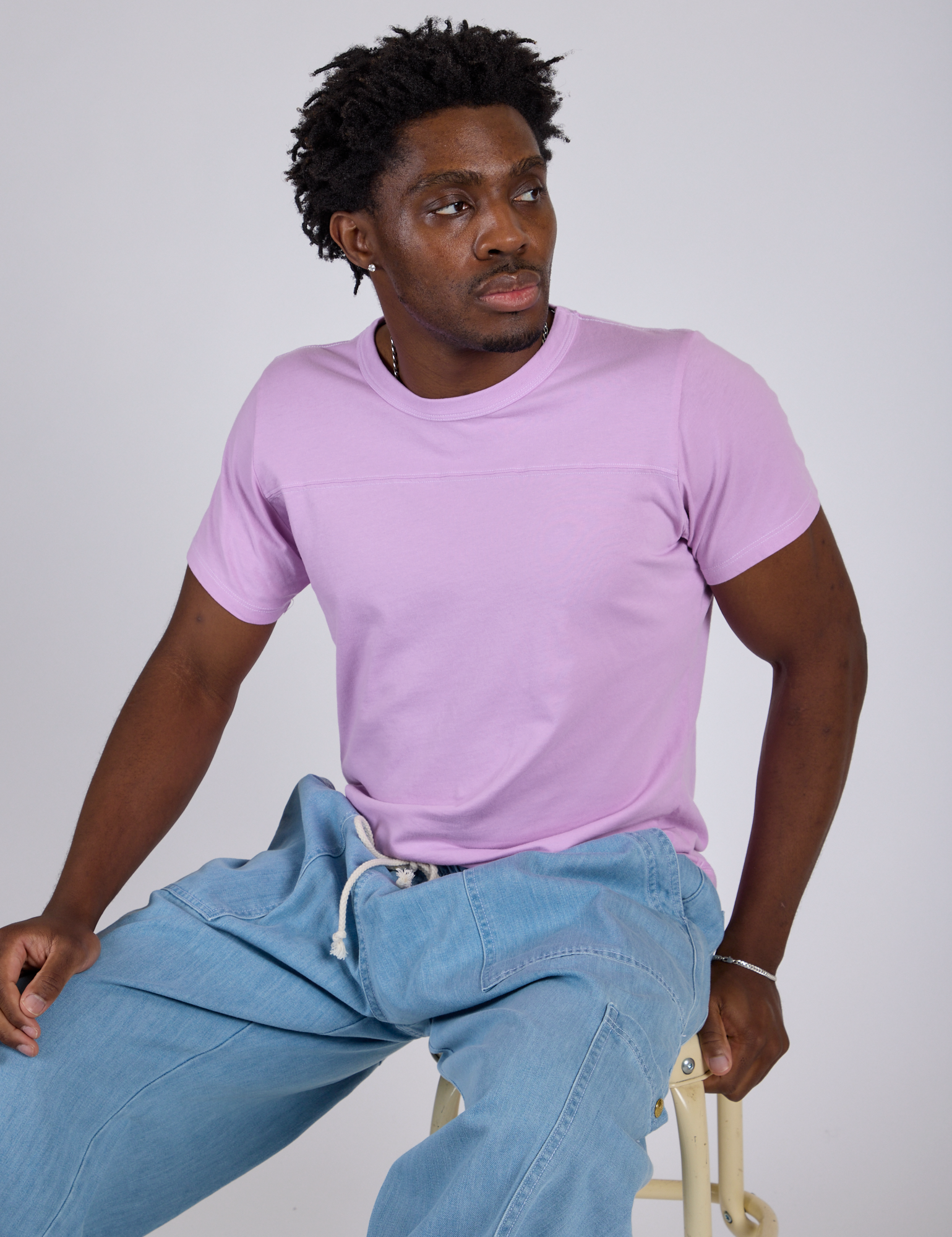 Jr. Varsity Tee in Lilac Purple worn by Isaac